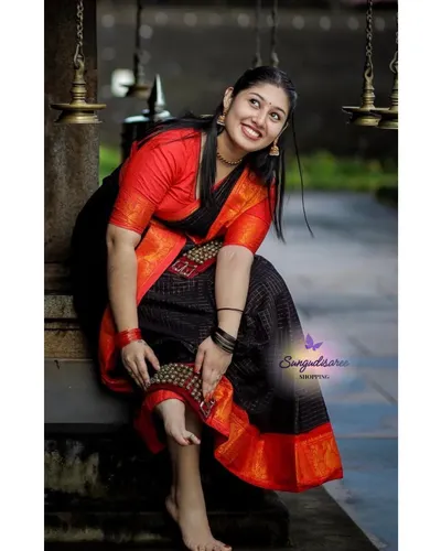Black with orange zarikattam sungudi saree