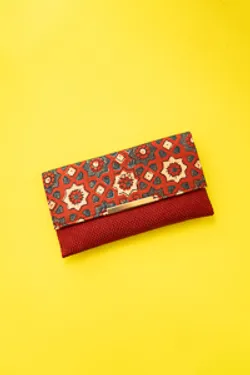 Red silk ikkat print sling clutch