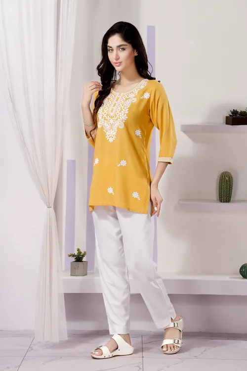 Trendy Short Kurti in White Rayon Fabric with Chikankari Embroidery