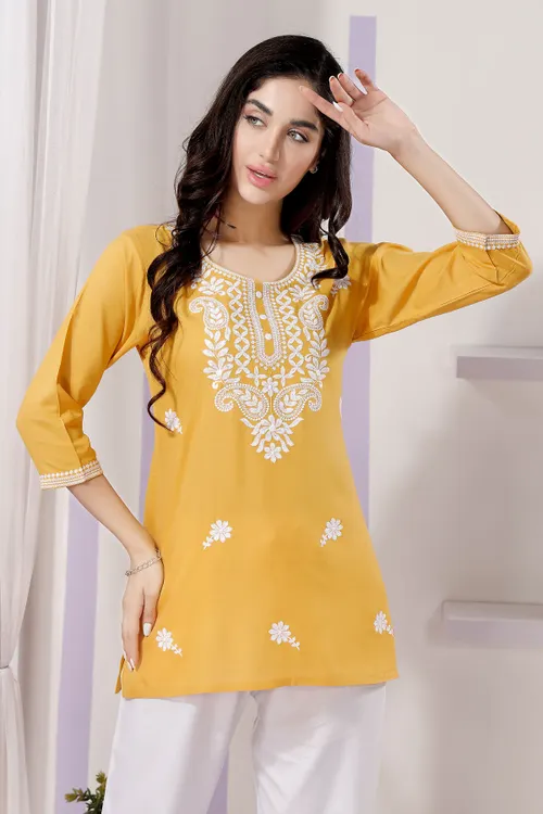 Trendy Short Kurti in White Rayon Fabric with Chikankari Embroidery