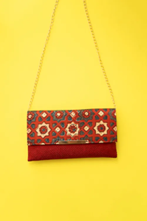 Red silk ikkat print sling clutch