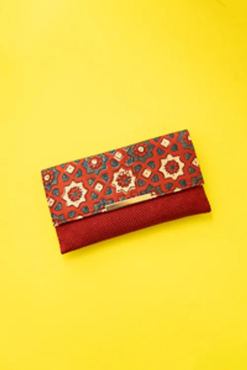 Red silk ikkat print sling clutch