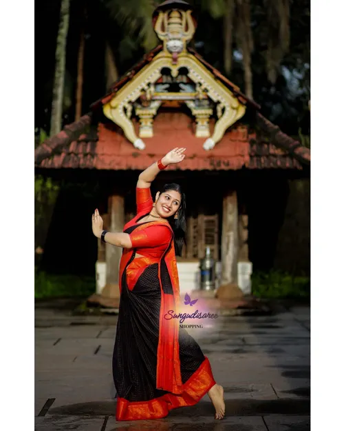 Black with orange zarikattam sungudi saree